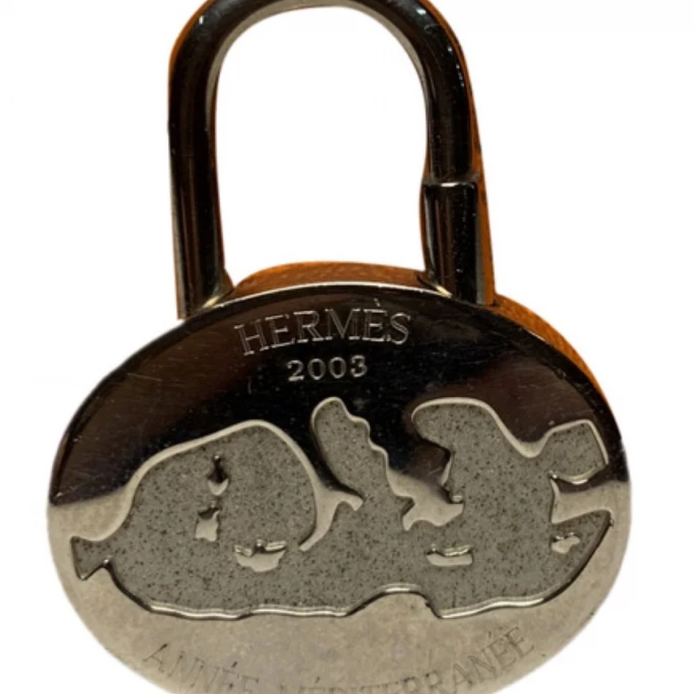 Hermès silver-plated Année Mediterranée 2003 Cadena lock charm.